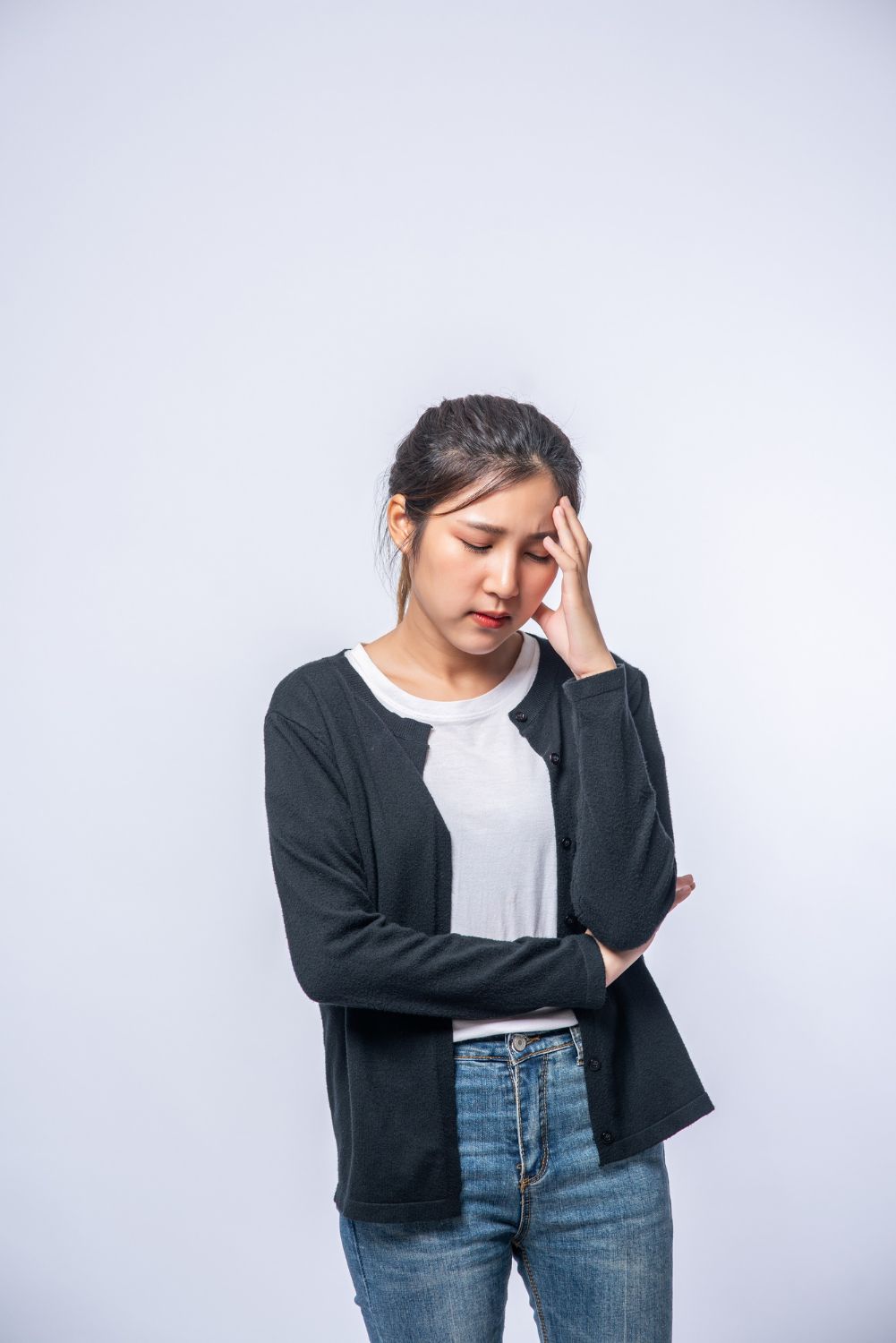 sick-woman-with-headache-put-her-hand-her-head Image